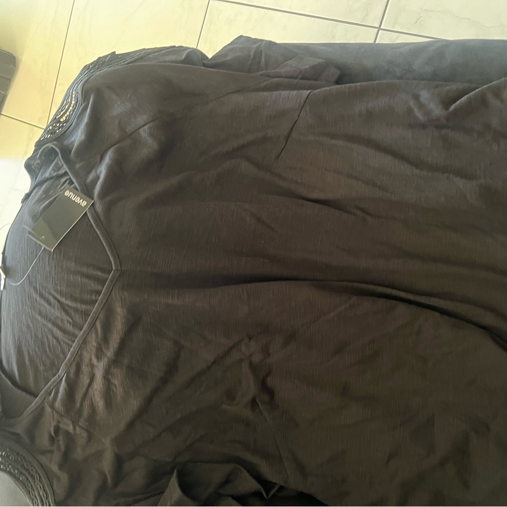 NWT black top with cool design on sleeves. A staple in all wardrobes.